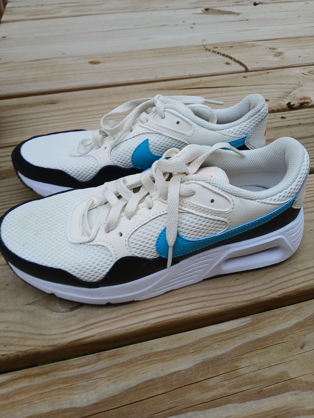 Nike White Mesh Sneakers with Bright Blue Swoosh and Black Trim